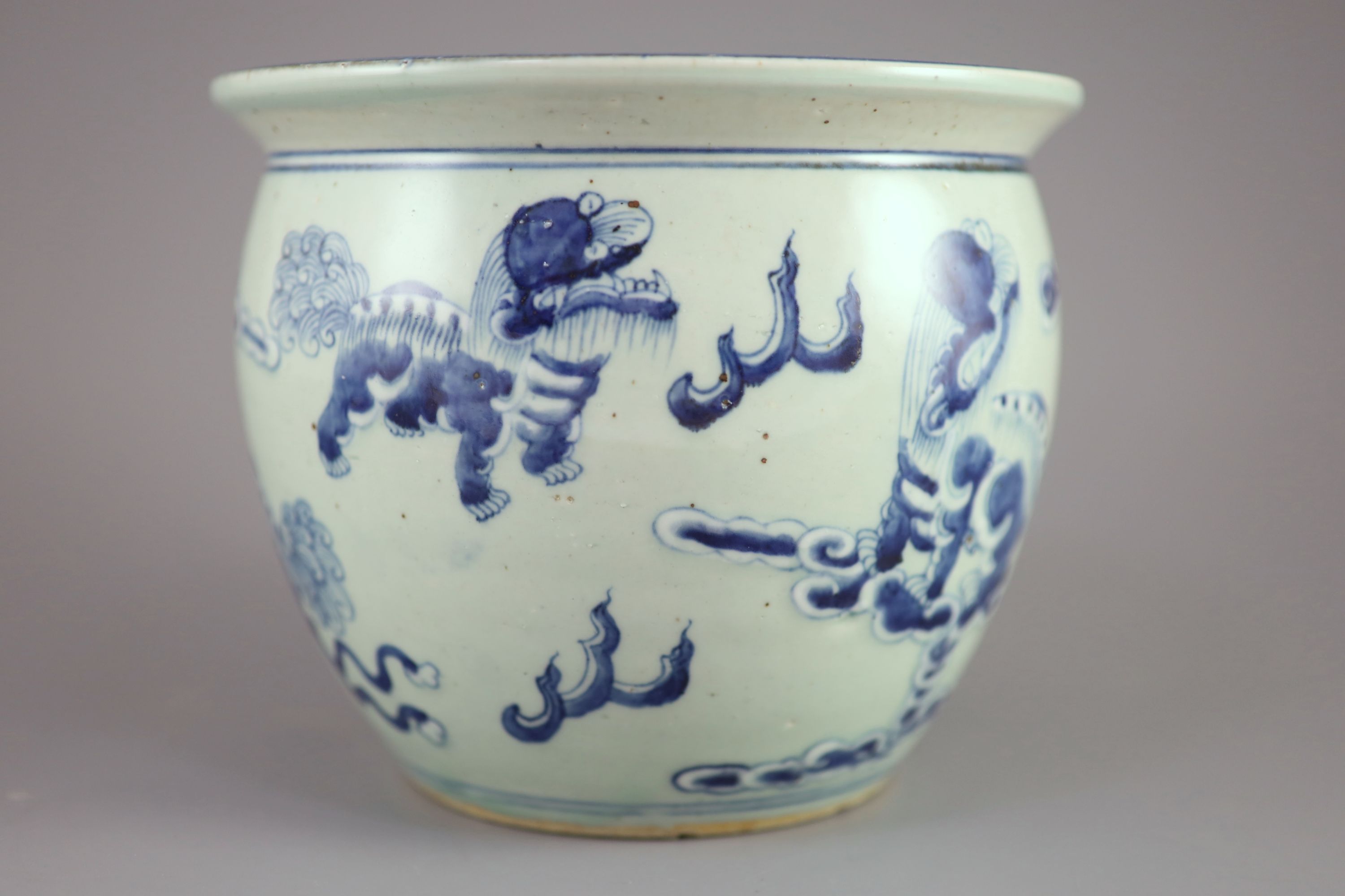 A Chinese blue and white 'lion-dog' flower pot, 20cm diameter